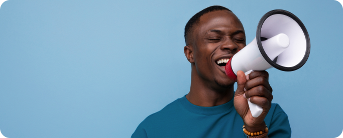 young successful handsome american guy dressed basic tshirt speaks news into megaphone tablet